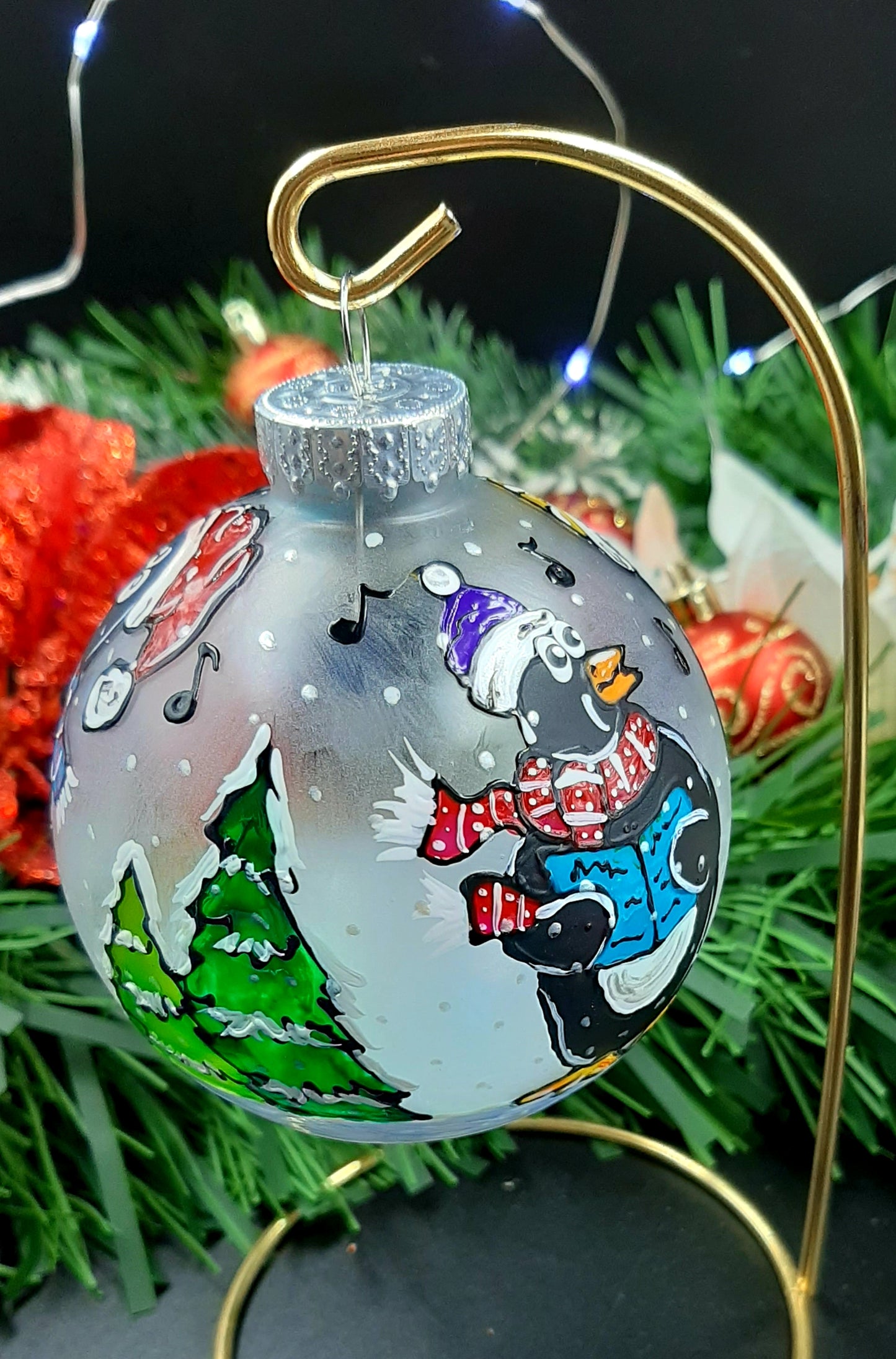 Boule de Noël chorale de pingouins